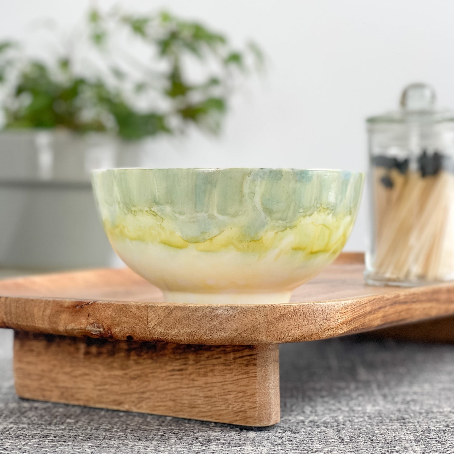 Ceramic soy candle handpainted in soft grayish green and pale yellow